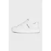 White leather sneakers with a signature logo