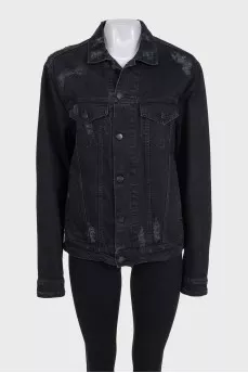 Black denim jacket with a distressed effect