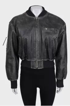 Insulated leather jacket with a distressed effect