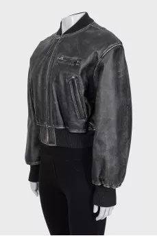 Insulated leather jacket with a distressed effect