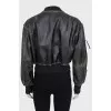 Insulated leather jacket with a distressed effect