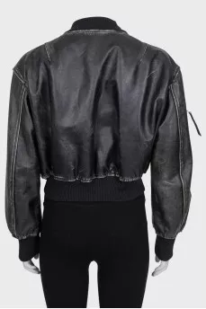 Insulated leather jacket with a distressed effect