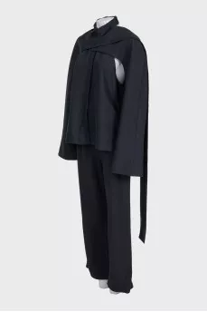 Black suit with trousers, top and cape