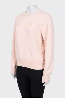 Pink sweatshirt with logo patch