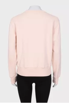 Pink sweatshirt with logo patch