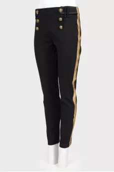 Pants with textured buttons and tag