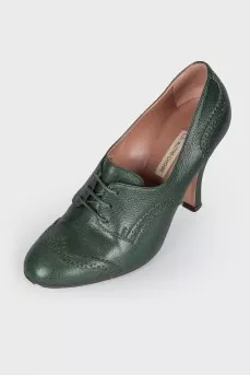 Green ankle boots with perforation