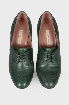 Green ankle boots with perforation