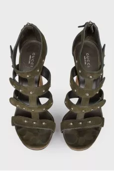 Suede sandals with wooden heels.