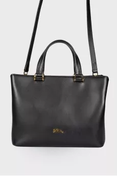 Leather bag with a metal logo brand