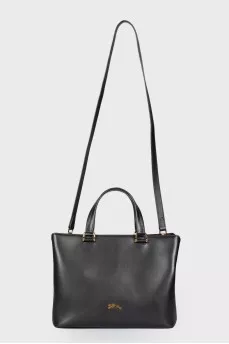 Leather bag with a metal logo brand