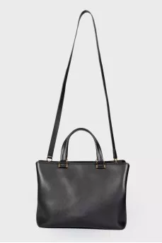 Leather bag with a metal logo brand