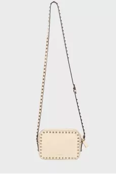 Milk-colored bag with spikes