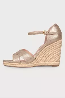 Golden sandals on a jute wedge