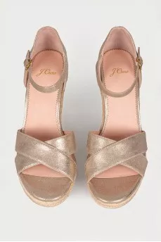 Golden sandals on a jute wedge
