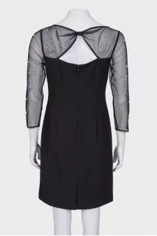 Dress with translucent sleeves and pearls