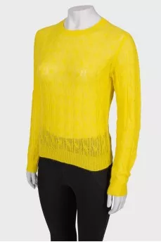 Translucent yellow sweater with a tag