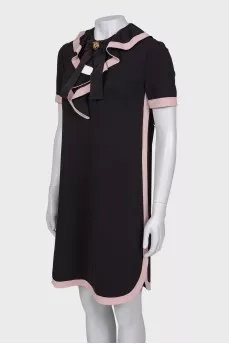 Black and pink dress with ruffles on the chest