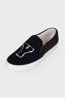 Black slip-ons in soft textile