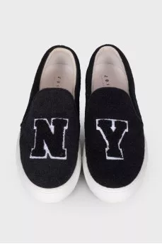 Black slip-ons in soft textile