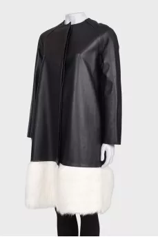 Leather coat with white fur on the hem