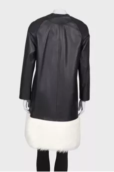 Leather coat with white fur on the hem