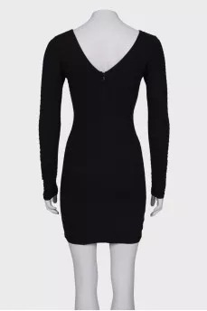 Black dress close-fitting in the waist