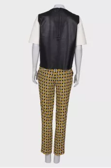 Suit with leather top