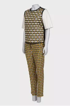 Suit with leather top