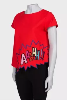 Red blouse with a patch at the bottom