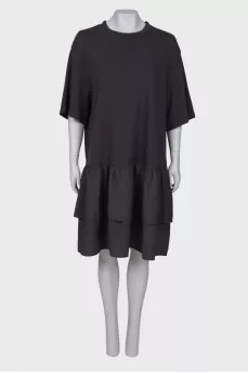 Dress with ruffles at the hem