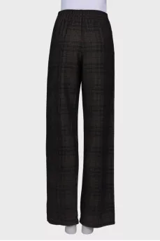 Wool trousers with press-studs on the sides