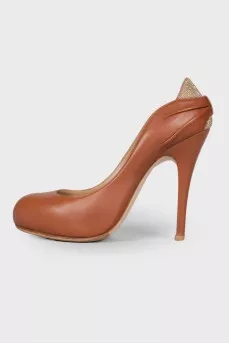 Leather shoes with rhinestones on the counter