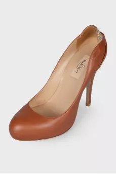 Leather shoes with rhinestones on the counter