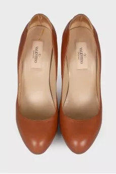Leather shoes with rhinestones on the counter