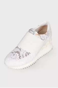 White sneakers with lace inserts