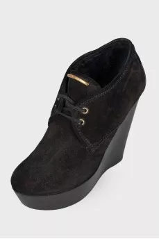 Black high wedge ankle boots