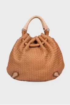 Woven semi-circular bag
