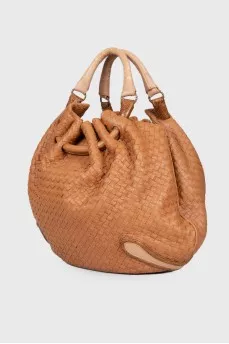 Woven semi-circular bag