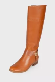 Brown leather boots with brand logo