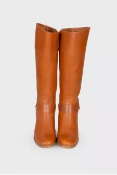 Brown leather boots with brand logo