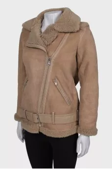 Beige sheepskin coat on the belt