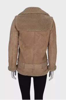 Beige sheepskin coat on the belt