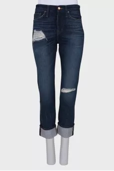 Ripped effect jeans with tag