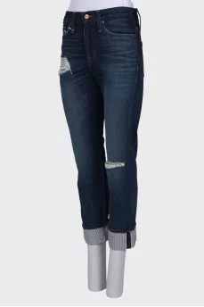 Ripped effect jeans with tag
