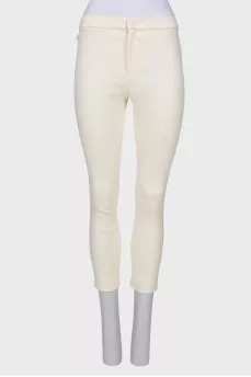 Cream trousers with tag