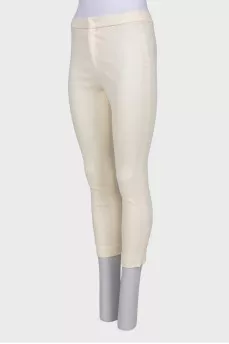 Cream trousers with tag
