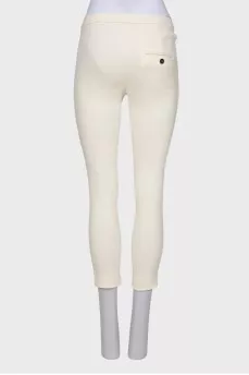 Cream trousers with tag