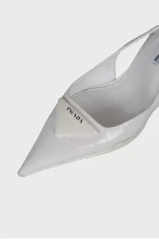 White slingbacks with brand logo