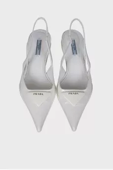White slingbacks with brand logo